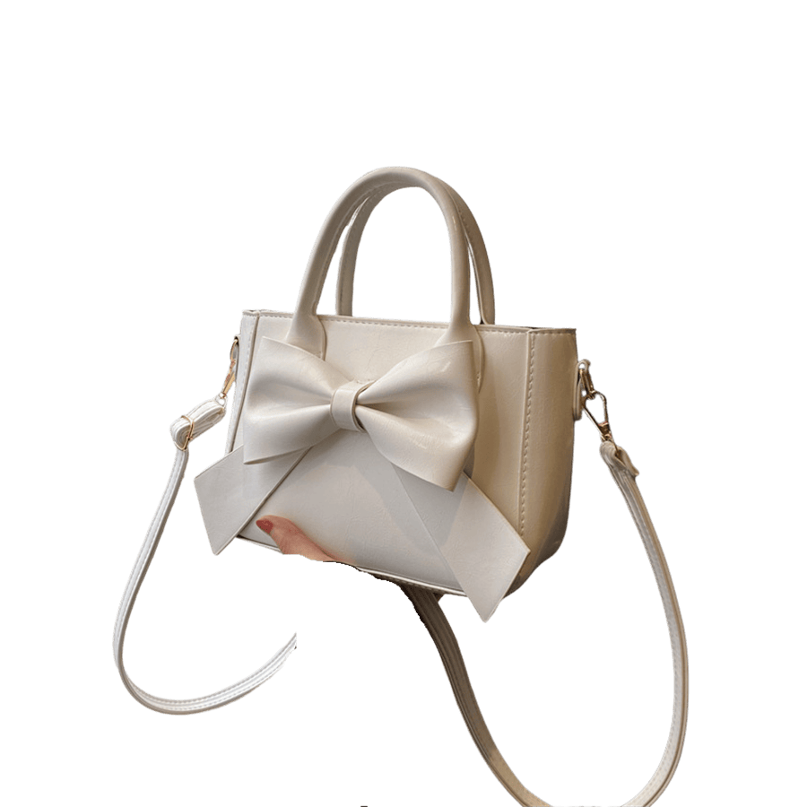 White ladies handbag with decorative bowknot on the front