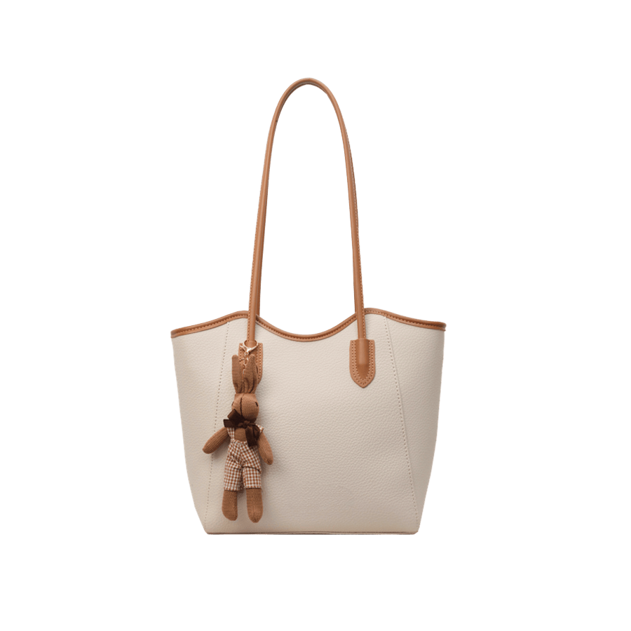 Beige ladies tote bag with brown trim PU and detachable toy hangtag