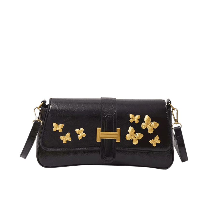 Black ladies crossbody bag with decorative metal butterfly and metal bridge