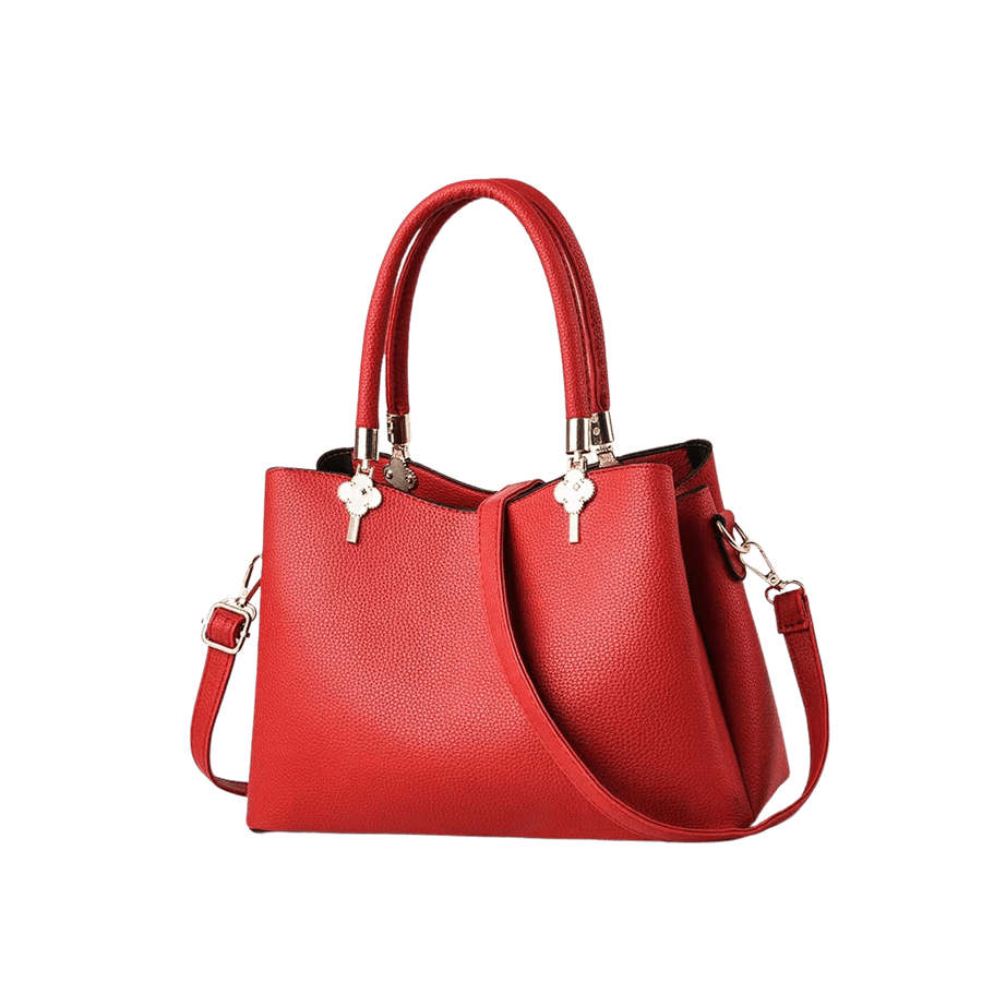 Red ladies handbag with metal flower tab of handle and contrast edge painting