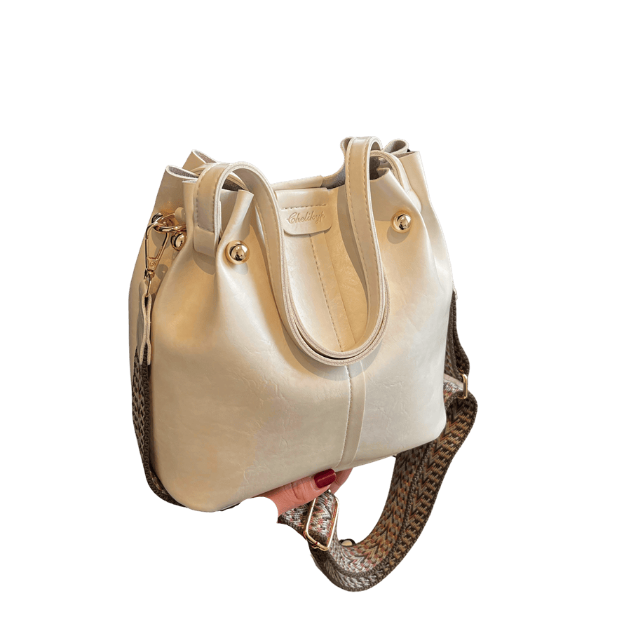 Beige splicing ladies bucket bag with jacquard webbing and metal bar on the top