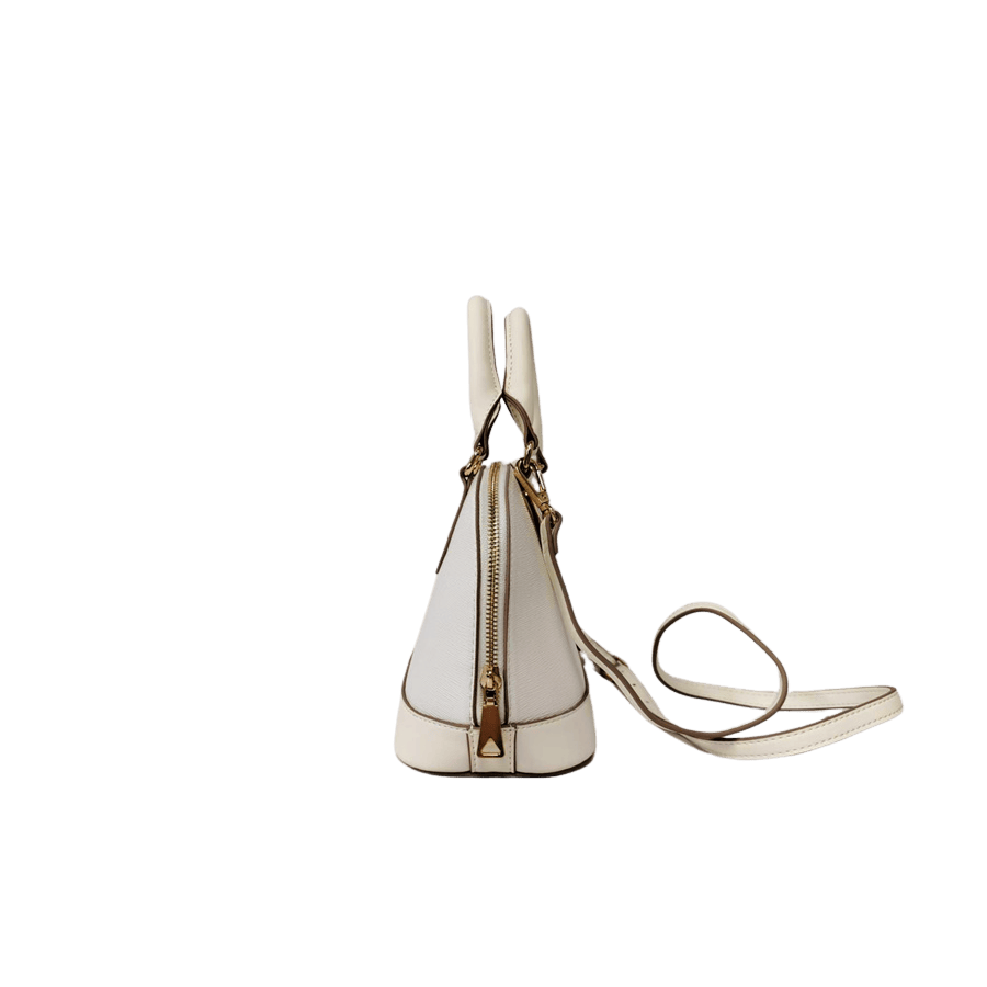 Beige ladies handbag with metal plate and contrast edge painting