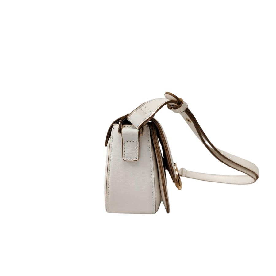 White ladies crossbody bag with decorative  hardware on the flap and contrast edge painting