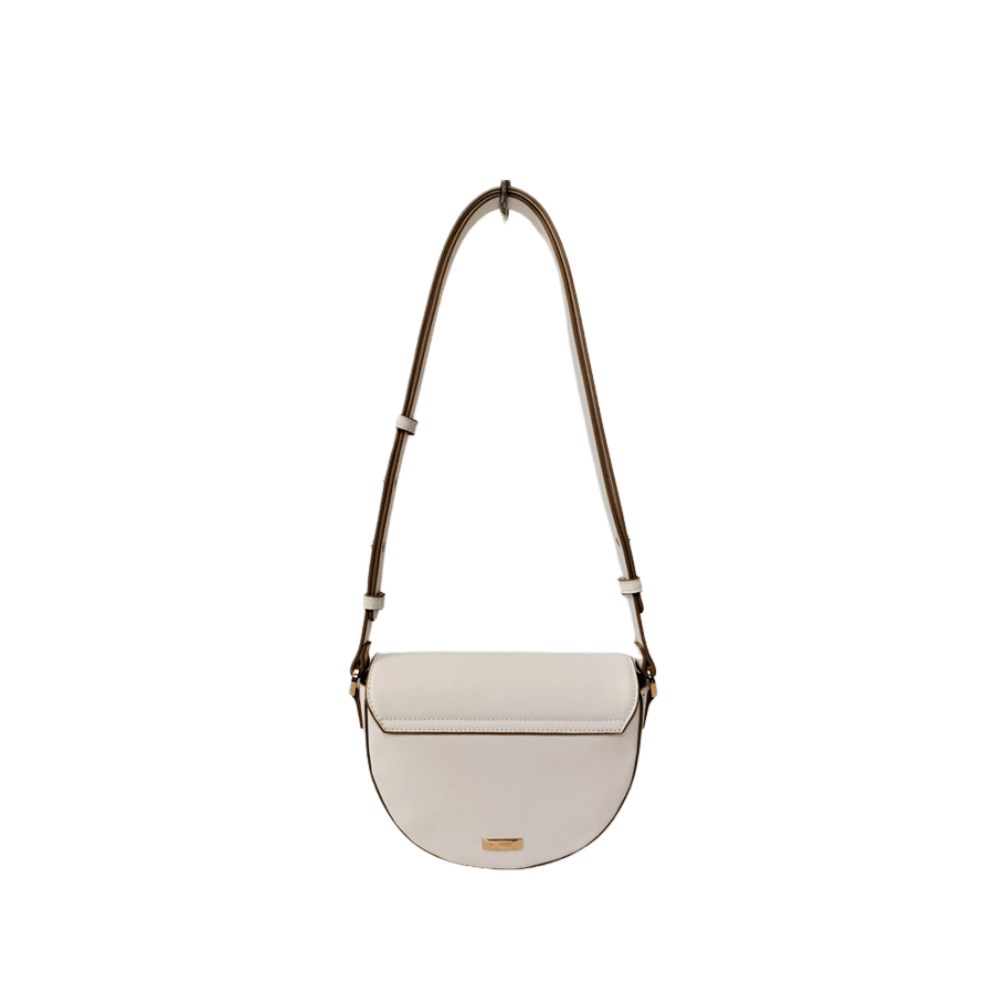 White ladies crossbody bag with decorative  hardware on the flap and contrast edge painting