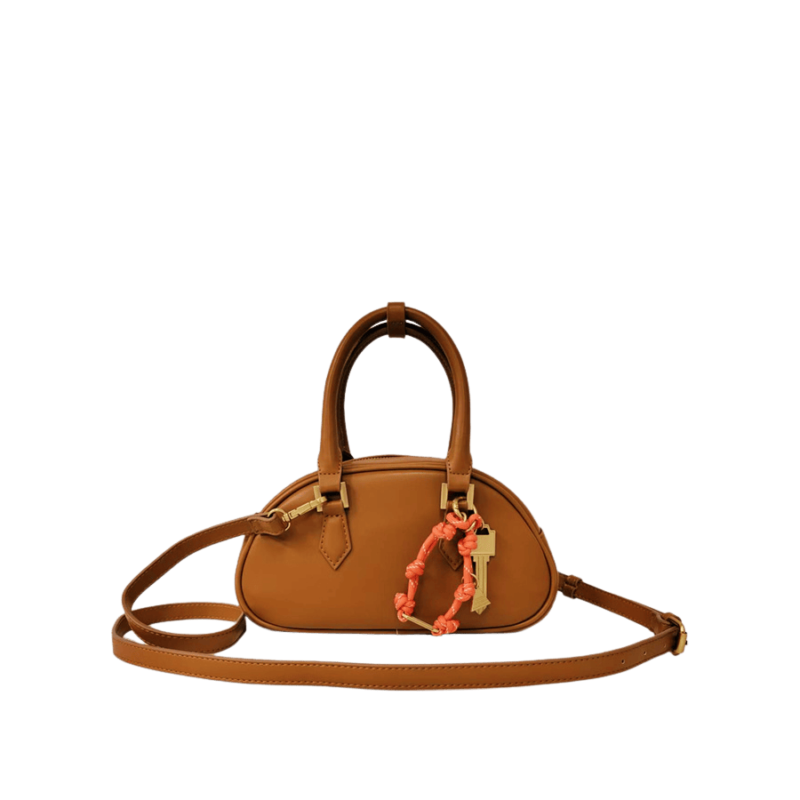 Camel ladies handbag with detachable string hangtag and piping arond the body