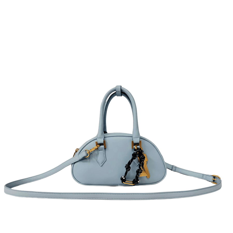 Camel ladies handbag with detachable string hangtag and piping arond the body