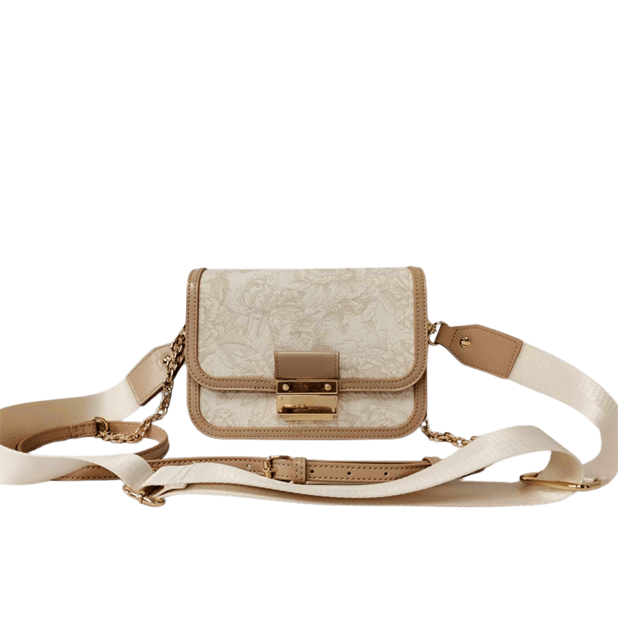 Crossbody bag with lock closure and metal plate on the back