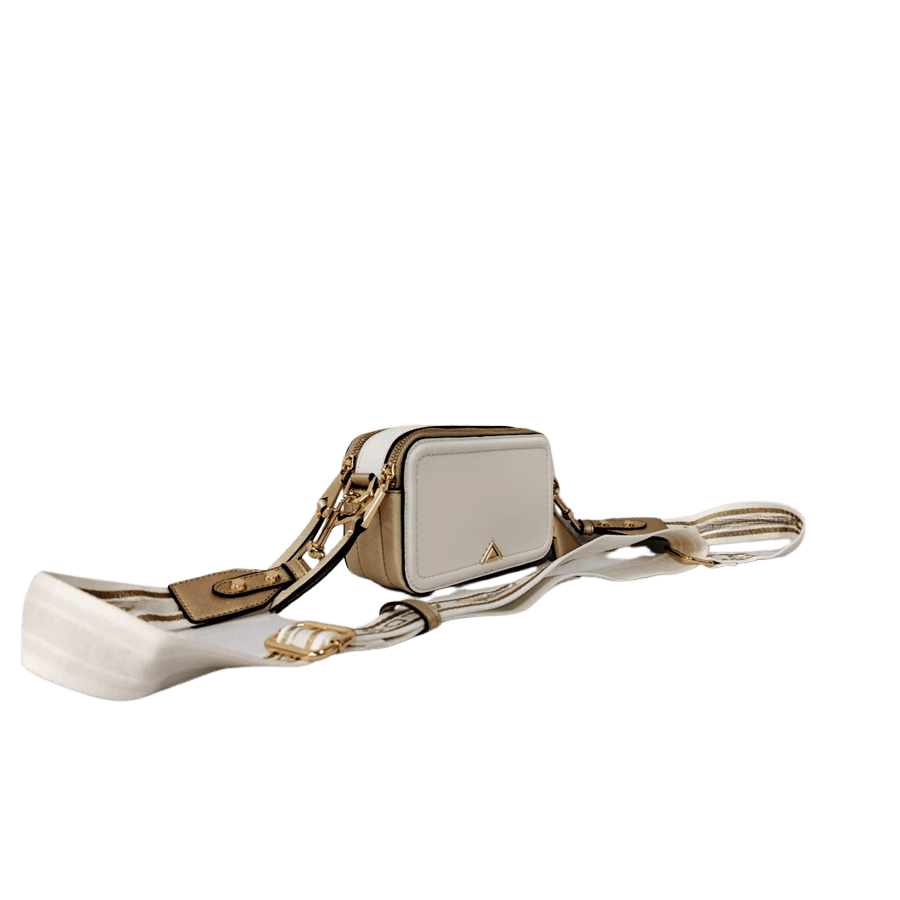 Ladies crossbody with decorative triangle hardware and card pocket on the back