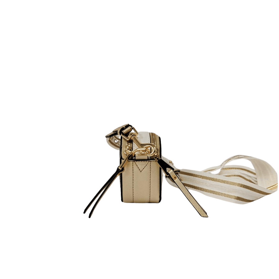 Ladies crossbody with decorative triangle hardware and card pocket on the back