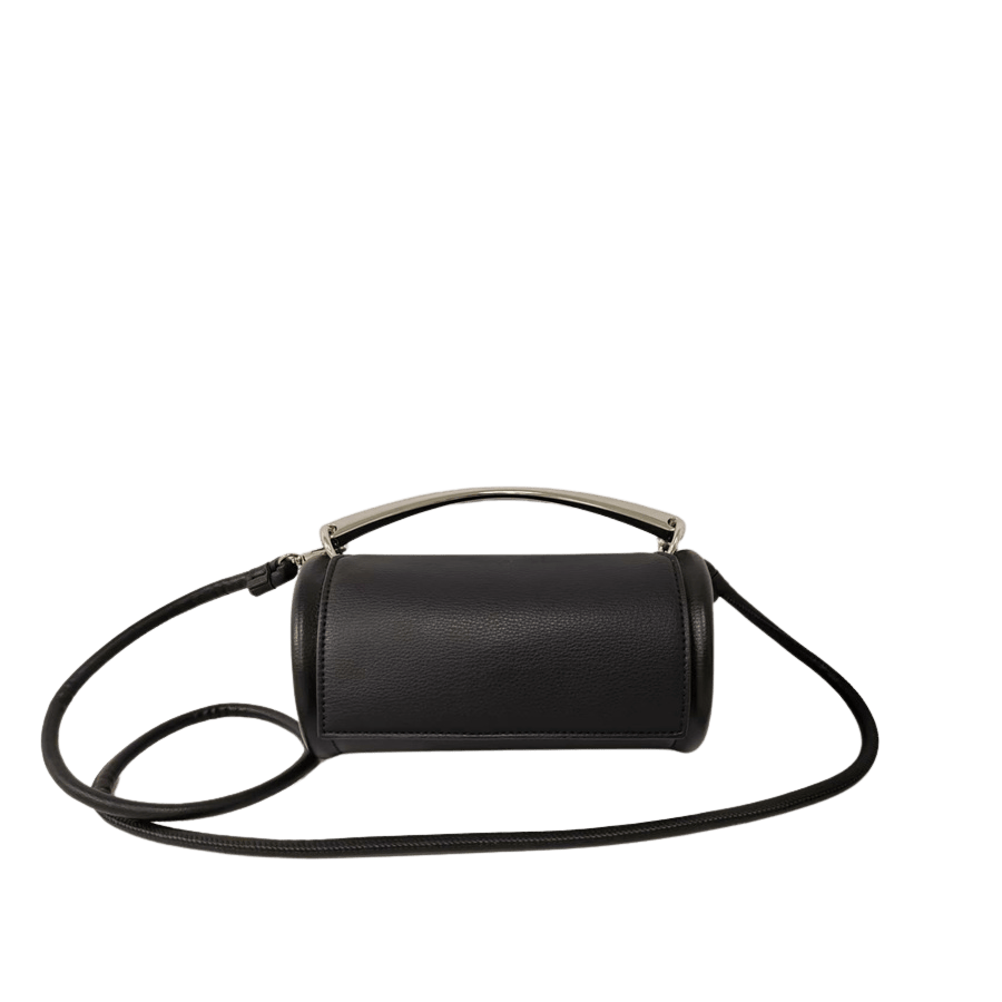 Beige cylinder ladies crossbody bag with metal handle and magnetic snap closure