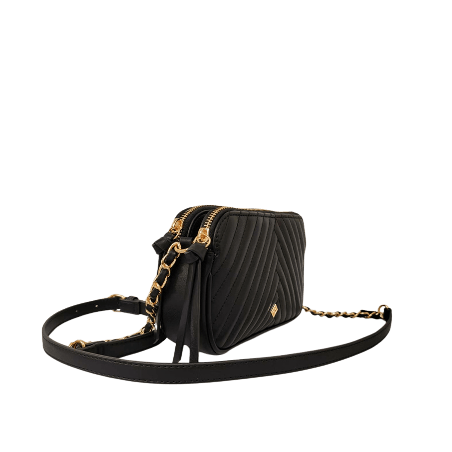 Black quilting ladies crossbody bag with decorative hardware and top zip closure