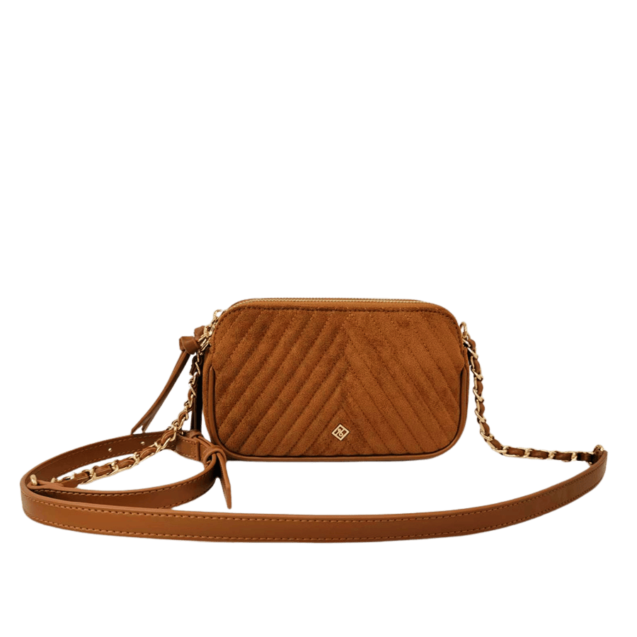 Black quilting ladies crossbody bag with decorative hardware and top zip closure