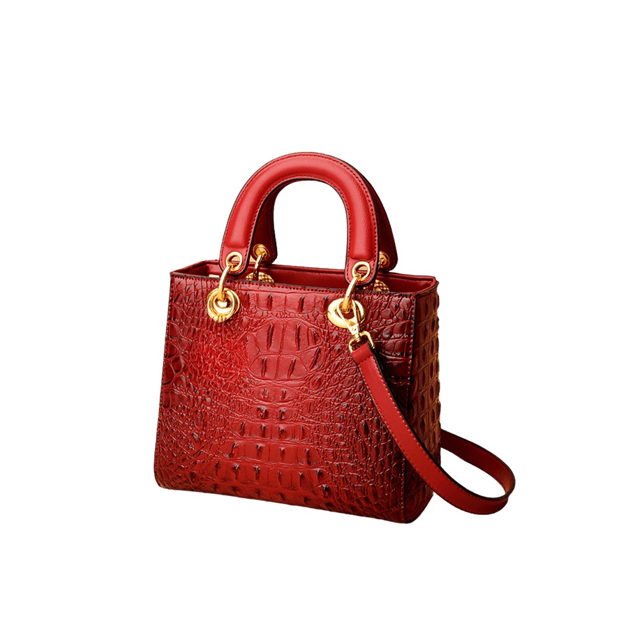 Red ostrich ladies handbag with round eyelets on the handle