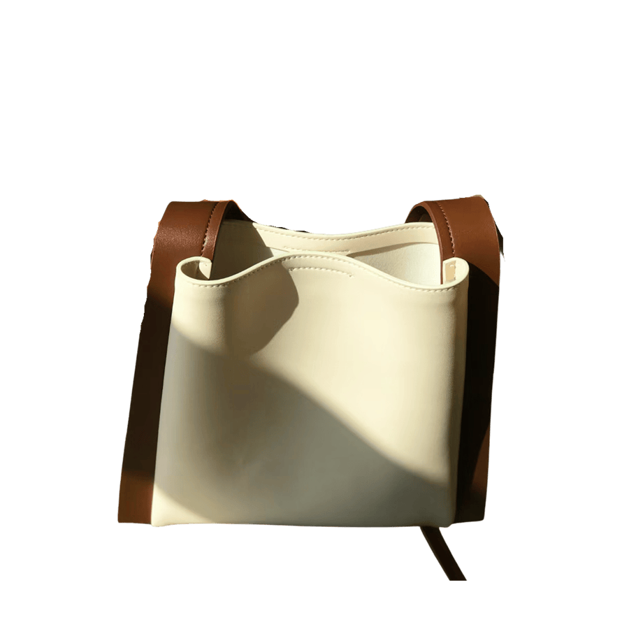 Beige ladies bucket bag with brown trim PU and magnetic snap closure