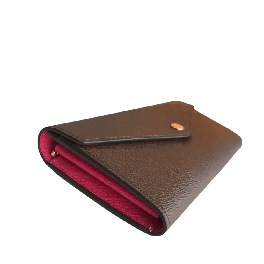 Brown ladies wallet with red cc slots and snap closure