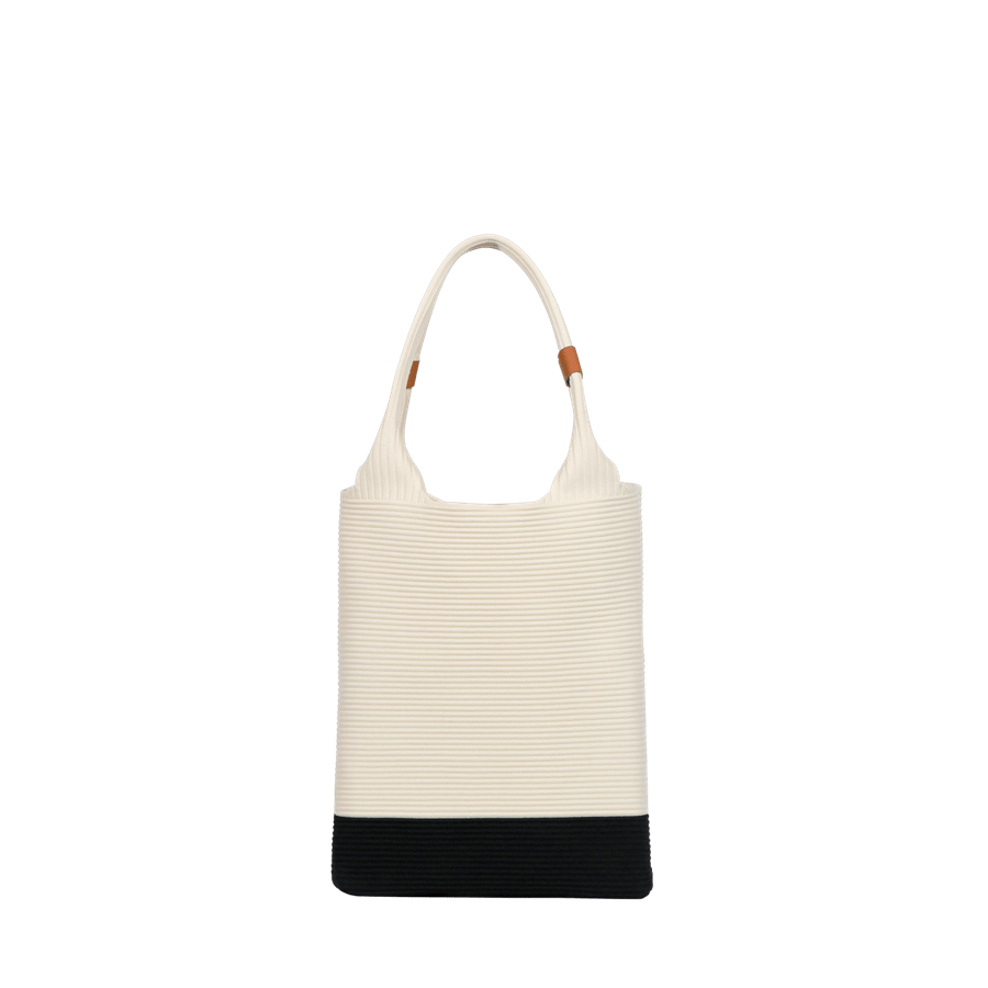 Beige crochet ladies handbag with black trim and PU tab on the handle