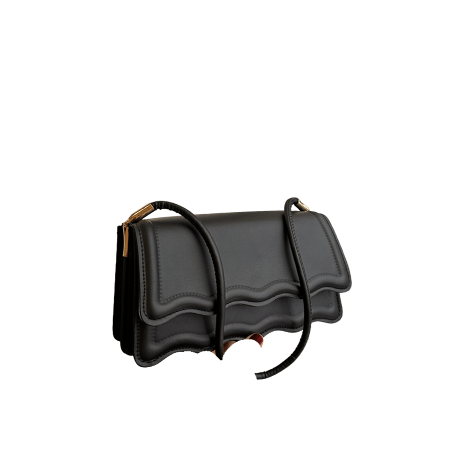 Black ladies  handbag with metal tab on the handle and bombe on the flap
