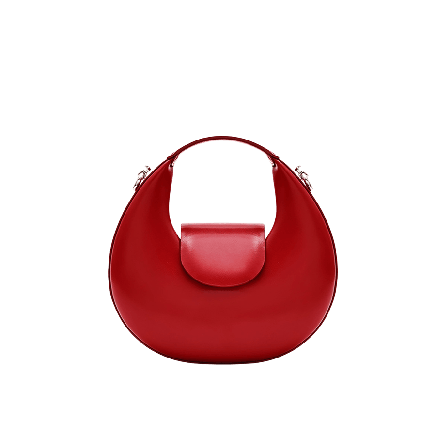 Red ladies structured handbag with metal tab of shoulder strap and magnetic snap closure