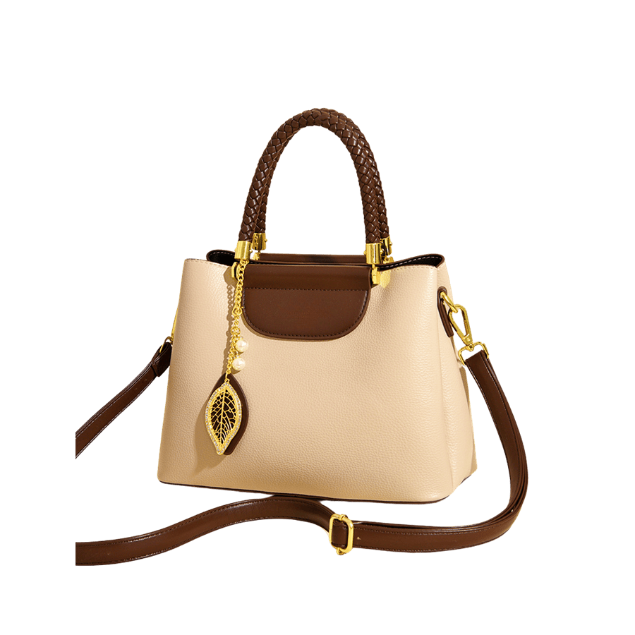 Beige ladies handbag with weave handle and detachable leaf hangtag