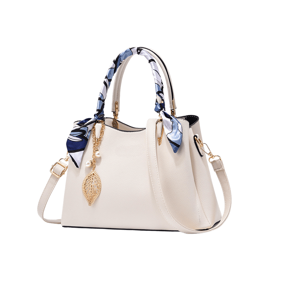 White ladies handbag with decorative scarf and detachable metal leaf hangtag