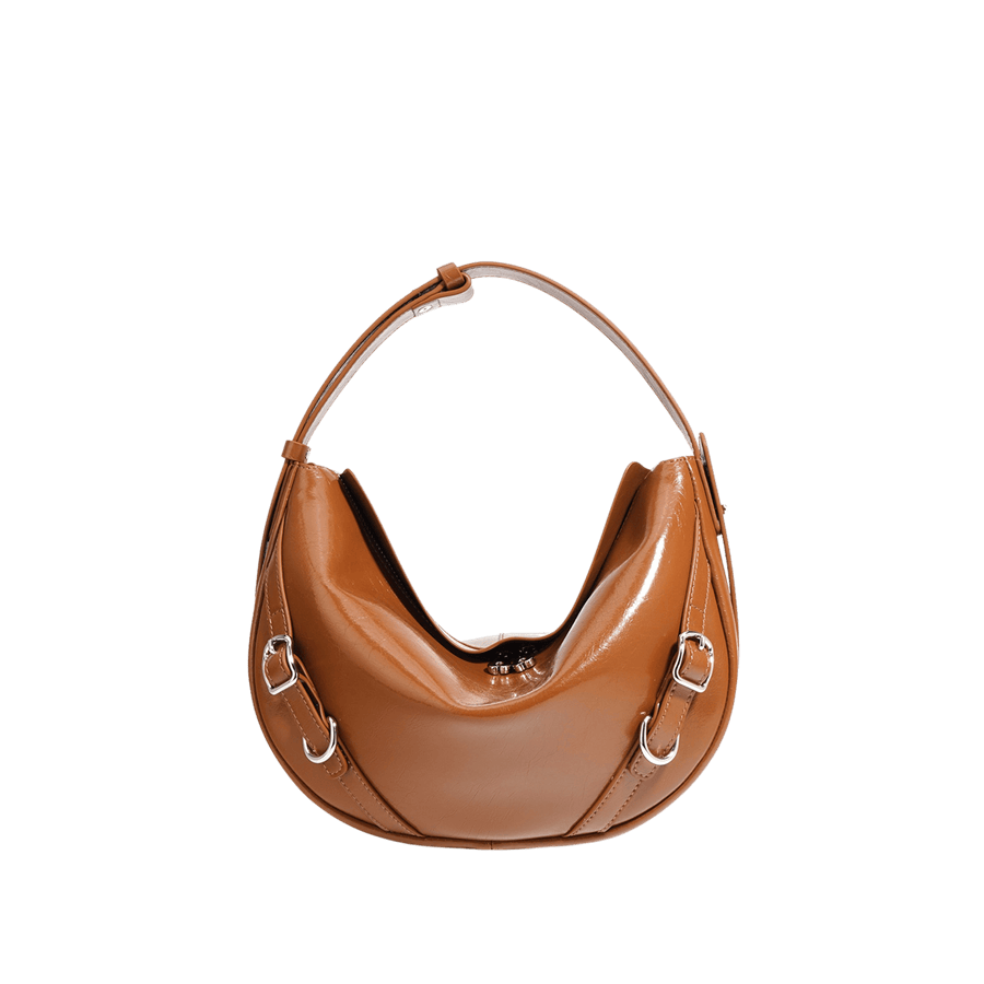 Camel ladies handbag with decorative straps and adjustable handle
