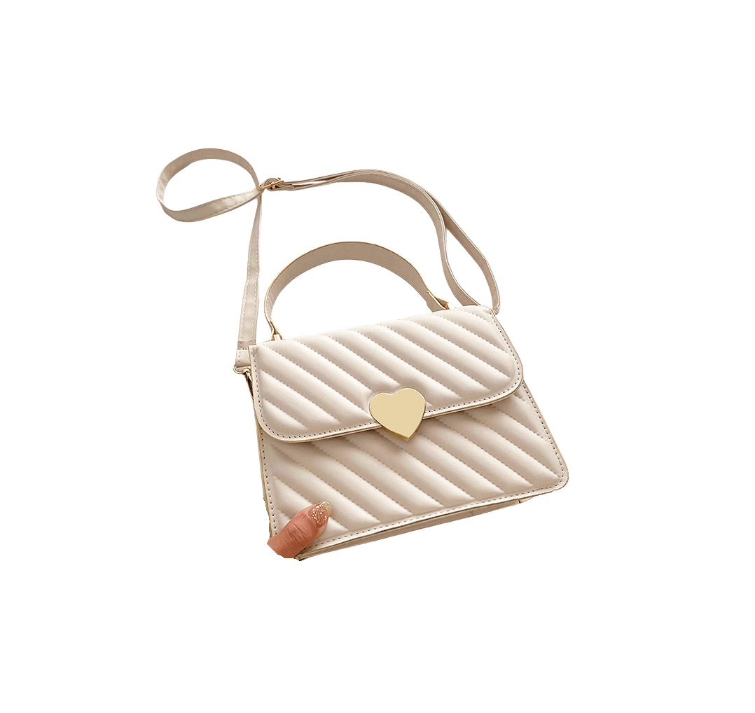 Beige quilting ladies handbag with heart-shaped hardware on the flap and magnetic snap closure