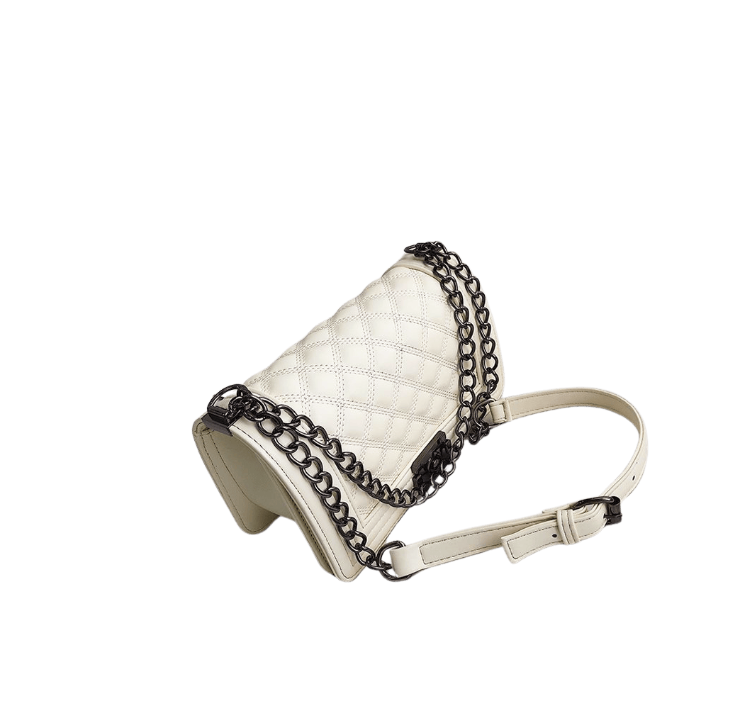 Beige quilting ladies handbag with lock closure and metal tab of the handle