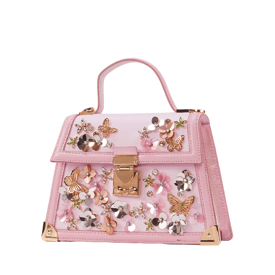 Pink ladies handbag with decorative flowers and betterflies