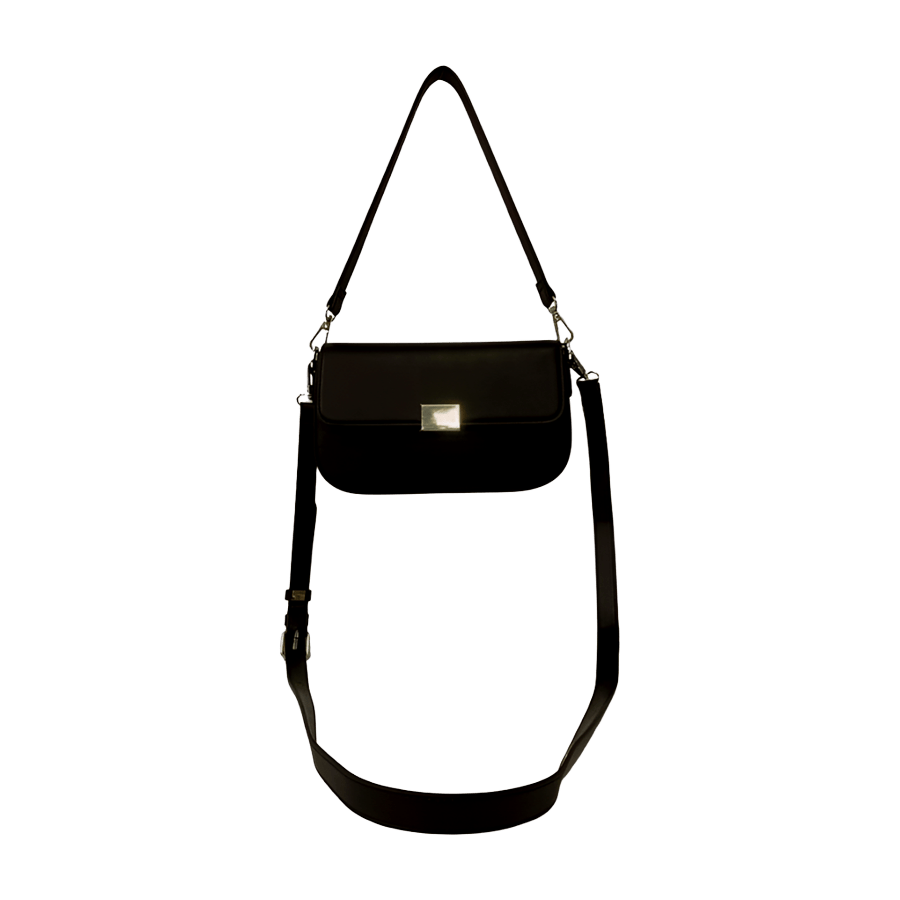 Black ladies handbag with metal plate on the flap