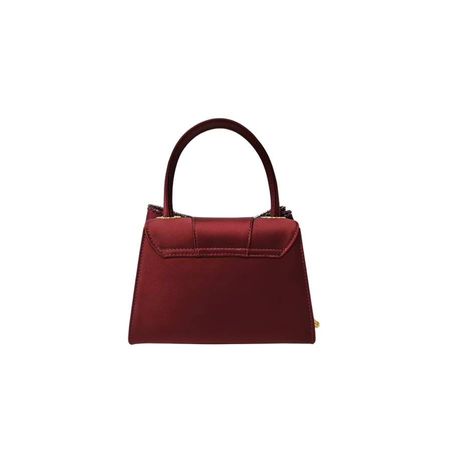 Burgundy ladies handbag with big bowknot and decorative eyelets on the top