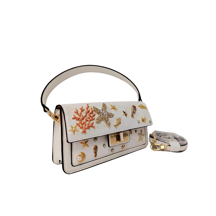 White ladies handbag with decorative accessories and black edge painting