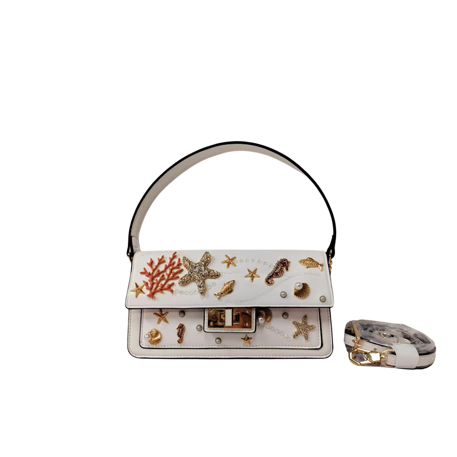 White ladies handbag with decorative accessories and black edge painting