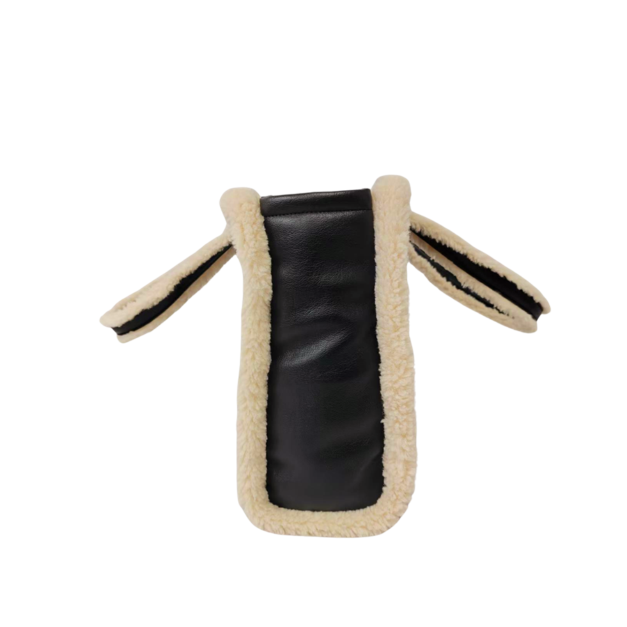 Black ladies tote bag with middle stitching and beige fake fur around the body