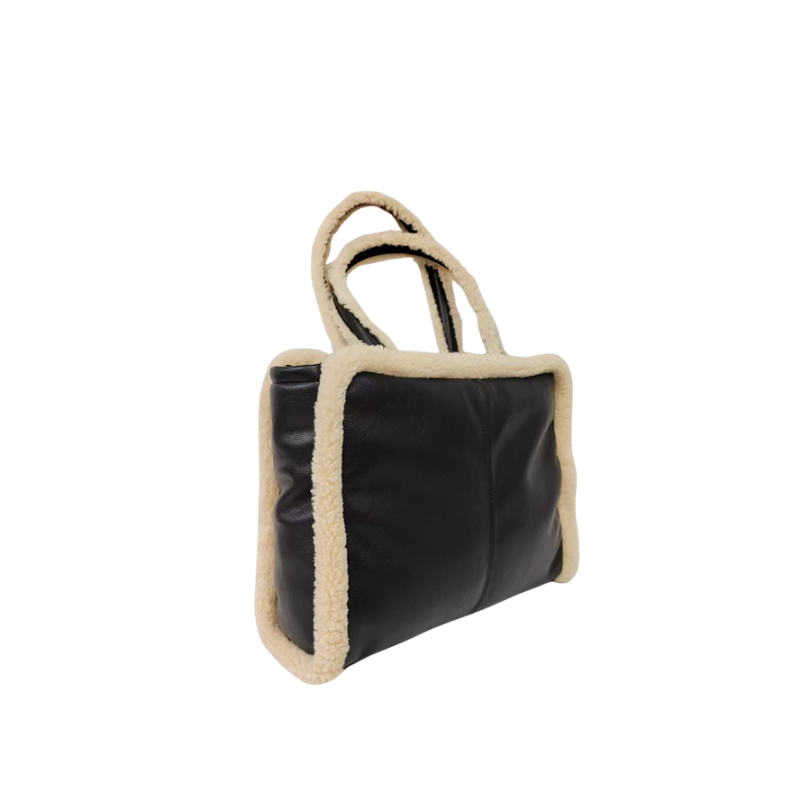Black ladies tote bag with middle stitching and beige fake fur around the body