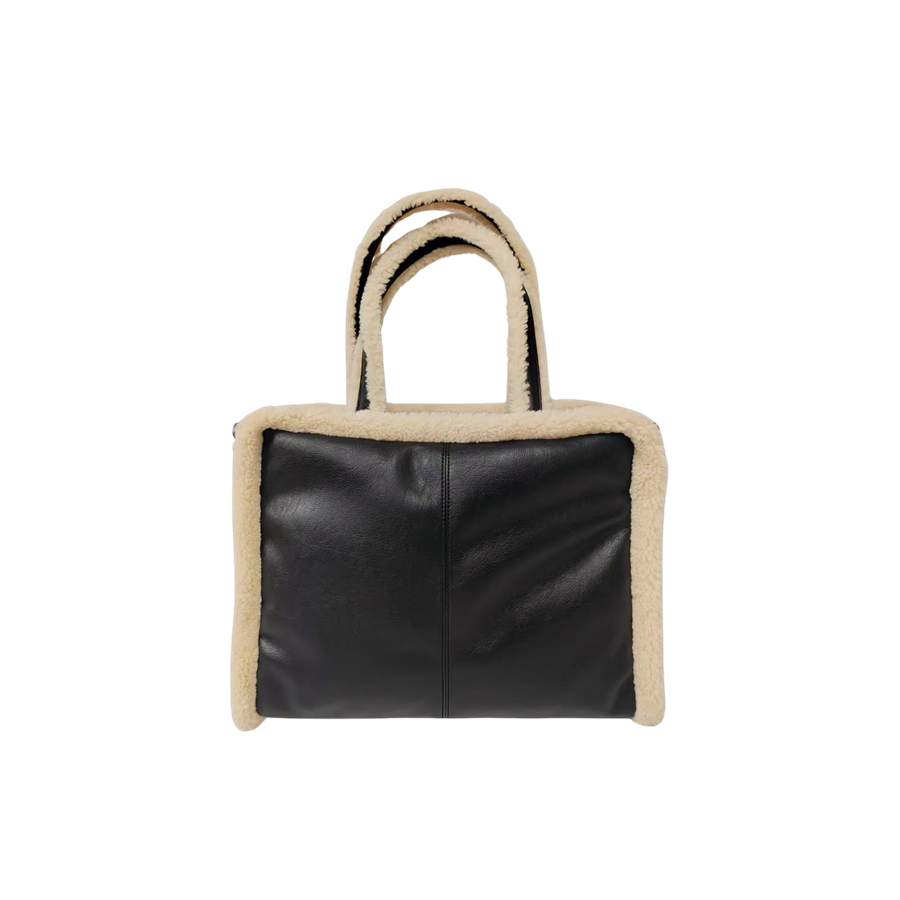 Black ladies tote bag with middle stitching and beige fake fur around the body