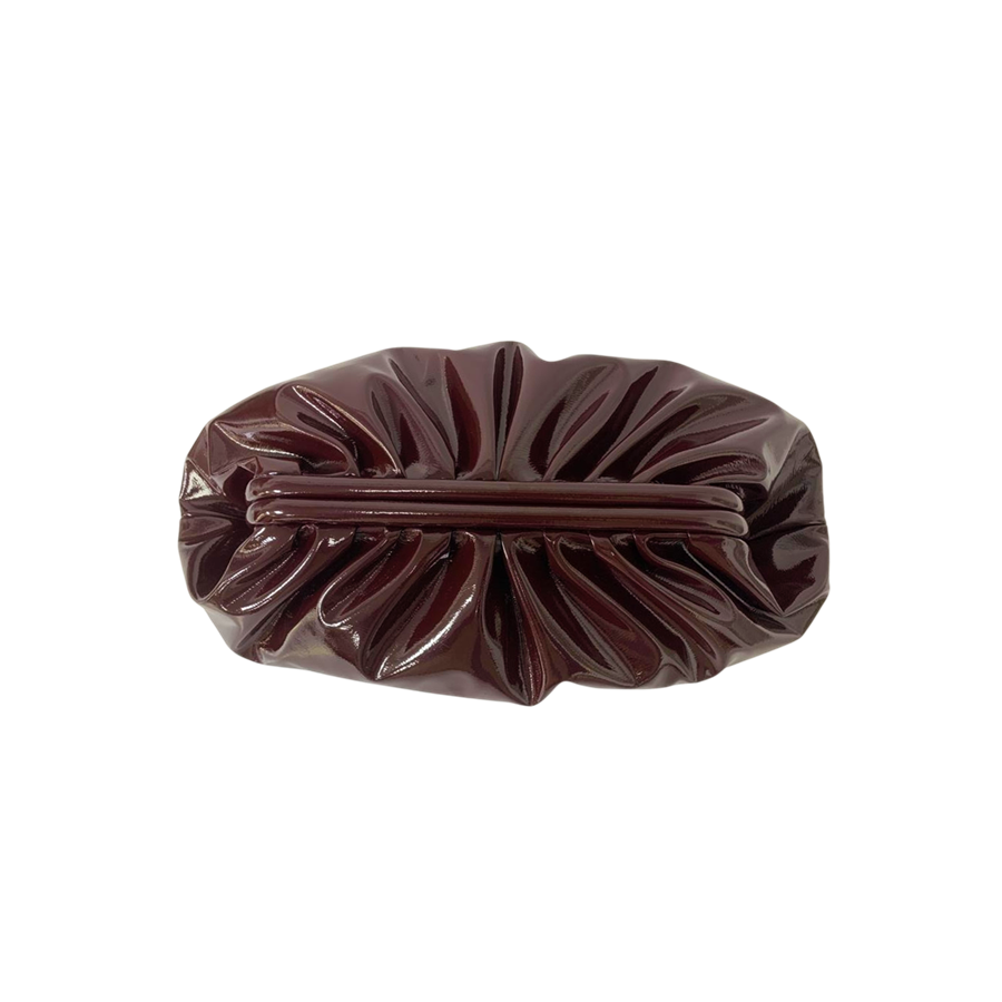 Brown ladies clutch bag with pleats on the body and frame closure