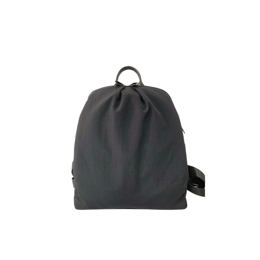 Black ladies backpack with decorative pleats and black trim PU
