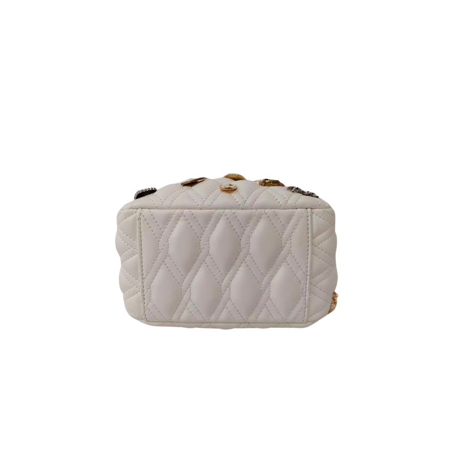 White quilting ladies drawstring bag with decorative accessories and metal stopper