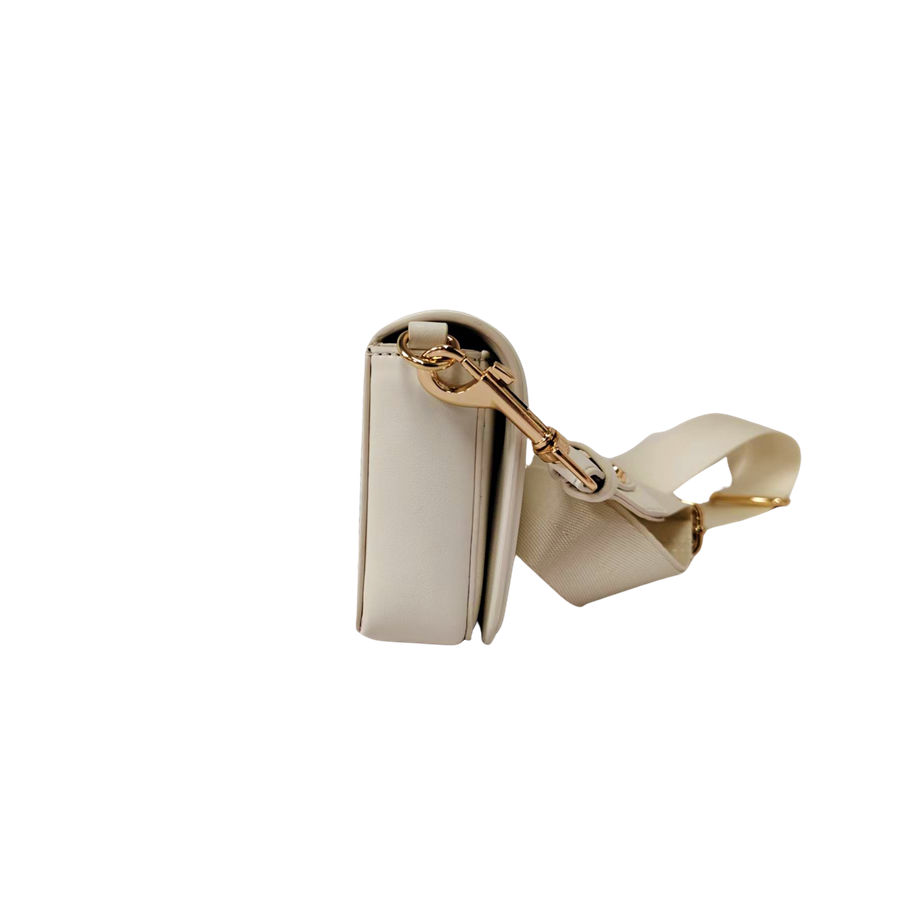 Beige ladies crossbody bag with decorative bombe and magnetic snap closure