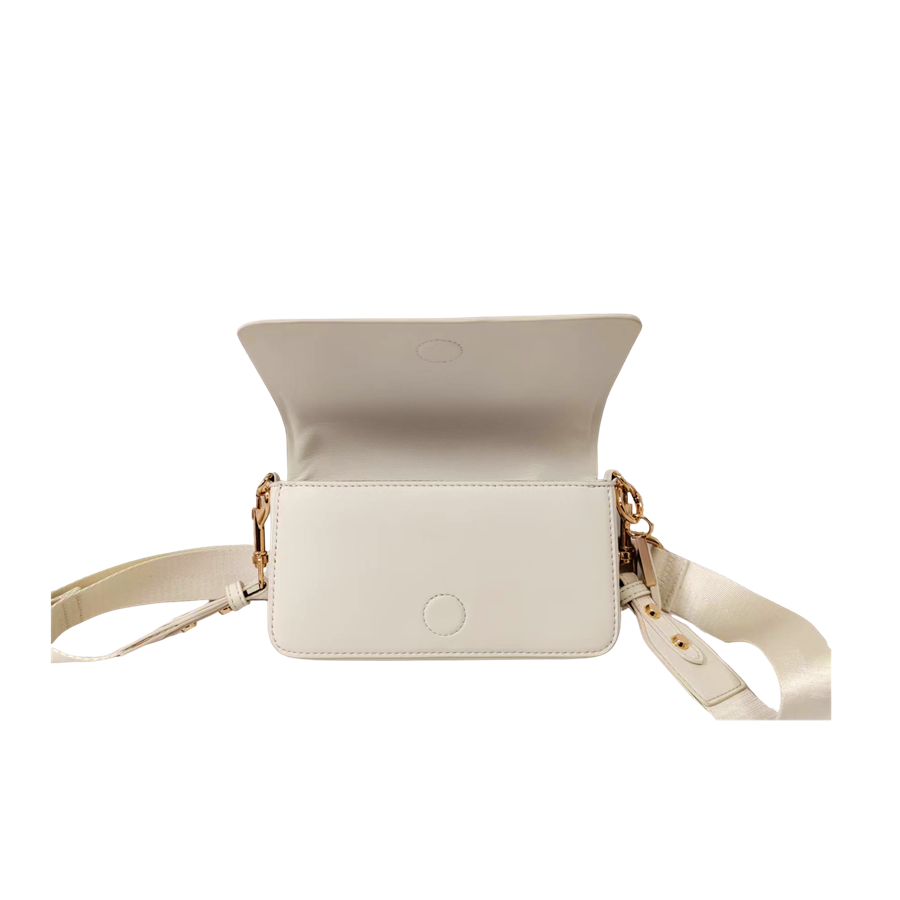 Beige ladies crossbody bag with decorative bombe and magnetic snap closure