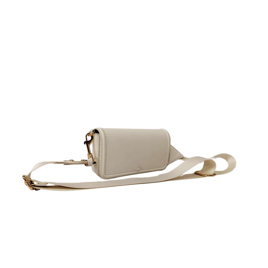 Beige ladies crossbody bag with decorative bombe and magnetic snap closure