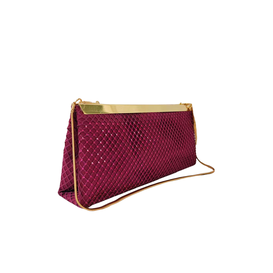 Burgundy ladies clutch bag with matching mesh on the surface and metal frame closure