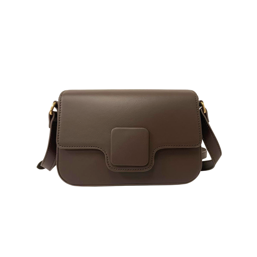 Brown ladies crossbody bag with decorative square plate and magnetic snap closure