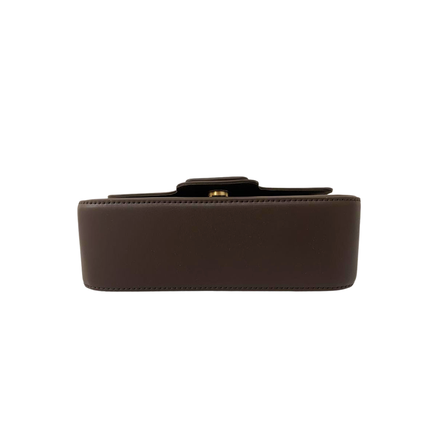 Brown ladies crossbody bag with decorative square plate and magnetic snap closure