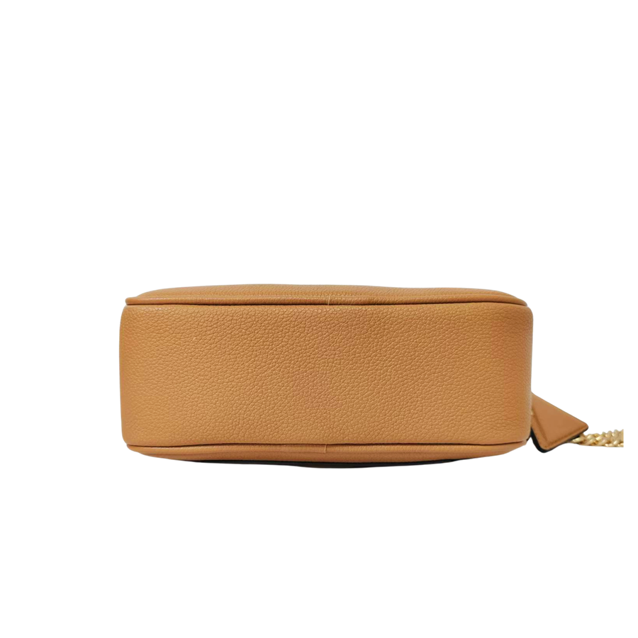 Camel ladies crossbod bag with decorative metal plate and detachable hangtag